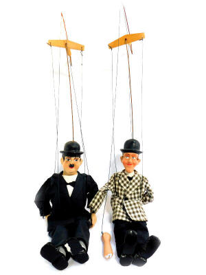 A pair of Laurel & Hardy puppets, figures 31cm high.