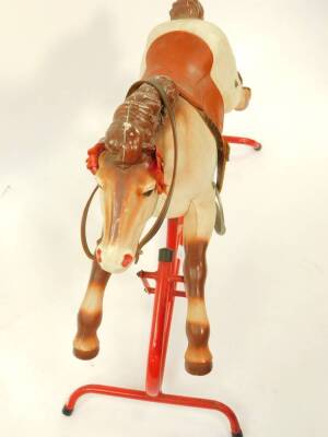 A Tri-ang plastic and red metal framed rocking horse, 82cm wide. - 2