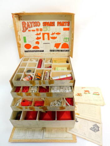 A Bayko spare parts chest, containing four trays of spares, instruction booklets, etc.