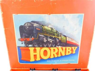A Hornby O guage train set, with a British Rail tank locomotive, black livery, 3/82011, four wagons and rails, boxed. - 3