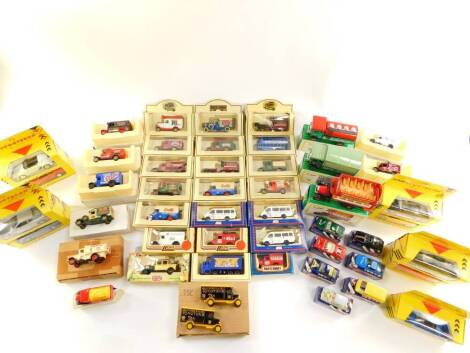 Corgi Lledo and other die cast vintage trucks, sports cars and horse drawn vehicles, all boxed. (1 box)