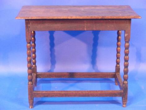 A late 17th Century oak side table