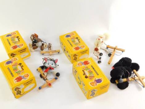 Four Pelham Standard puppets, comprising Cat, Poodle (x2), and Bengo, boxed.