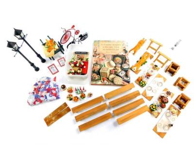 A doll's house School Golden Jubilee Street Party set, including cakes, bread and plates of food, a cart, bicycles, trestle tables, etc. (1 box)