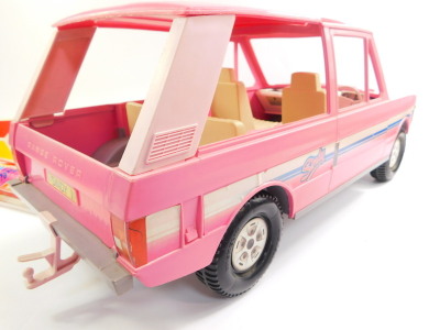 A Sindy Range Rover, registration Sindy !, two tone pink, 61cm wide, together with a Sindy surf board, 47cm wide. (2) - 3