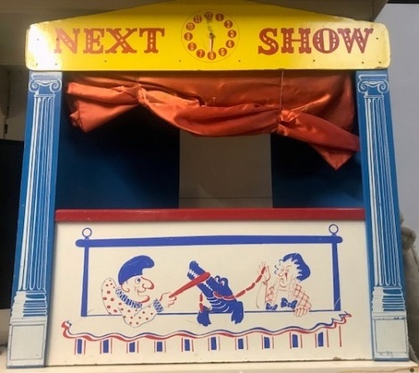 A wooden puppet show theatre, with fold in collapsible back.