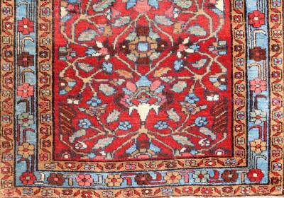 A Hammadan carpet runner, with stylised floral central field on red ground, enclosed by triple borders, with a turquoise central band, 320cm x 92cm. - 2