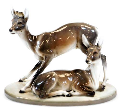 A Goldschieder Art Deco figure of two deer, model number 4760/49/6, artist initial F, 29cm high, 37cm wide. (antlers missing)