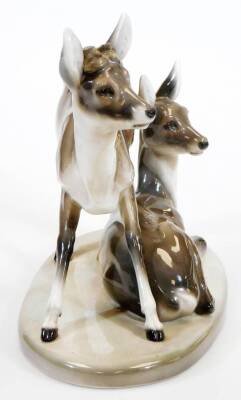 A Goldschieder Art Deco figure of two deer, model number 4760/49/6, artist initial F, 29cm high, 37cm wide. (antlers missing) - 2