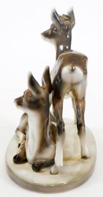 A Goldschieder Art Deco figure of two deer, model number 4760/49/6, artist initial F, 29cm high, 37cm wide. (antlers missing) - 4