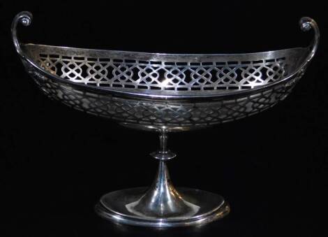 A George V silver dish, of boat shape with a partially pierced upper repeat border, on an inverted stem and oval foot, marked 10th June 1915, Birmingham 1911, 20cm wide, 5.8oz.