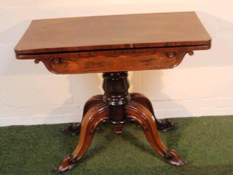 A Victorian rosewood card table