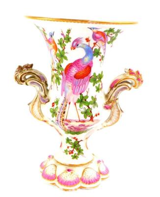 A Chelsea type porcelain vase, of twin handled baluster form, painted with exotic birds, the base moulded with shells, 21.5cm high. (AF)