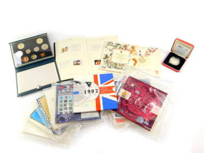 The United Kingdom Uncirculated Coin Collections, 1983-1985, 1987-1994., Commonwealth Games Commemorative £2 coin 1986., 1989 Royal Mint cased uncirculated coin collection., Millennium silver £5 coin, case., and a Queen Silver Jubilee 1977 philatelic stam