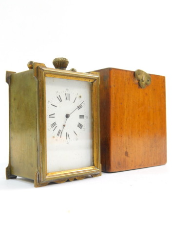 A Mignonnette Remontoir brass cased miniature carriage clock, rectangular dial bearing Roman numerals, Japy Freres movement, in a wooden outer case, bearing label for The French Clock Company 3876 Oxford Street, Marriott & Company, 5.5cm wide, 7.5cm high.