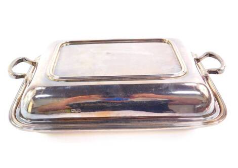 A George V silver entree dish and cover, of rectangular form, Birmingham 1931, 48.40oz.