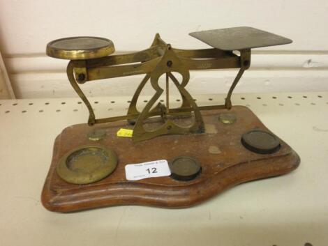 A set of early 20thC brass and mahogany postal scales