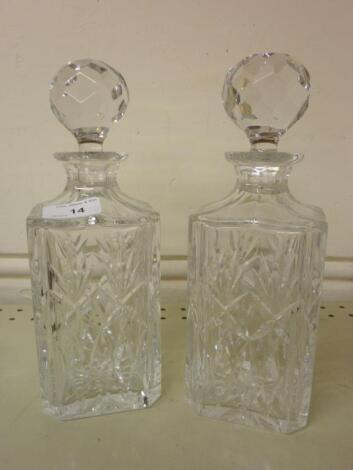 A pair of cut glass square section decanters and stoppers <br