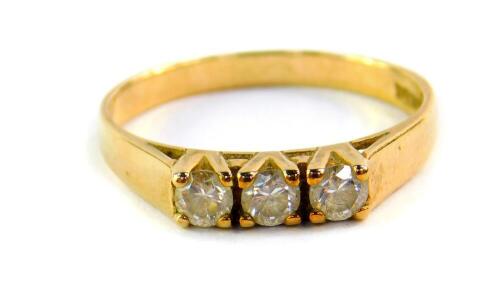 A 9ct gold and zircon three stone ring, high claw set, size L, 1.7g.