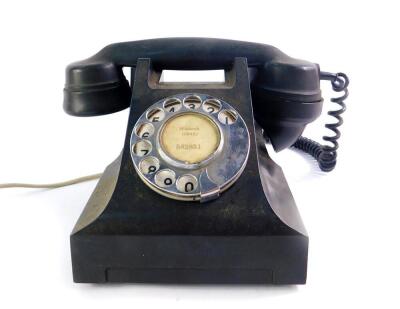 A black Bakelite GEC telephone with a Wisbech number.