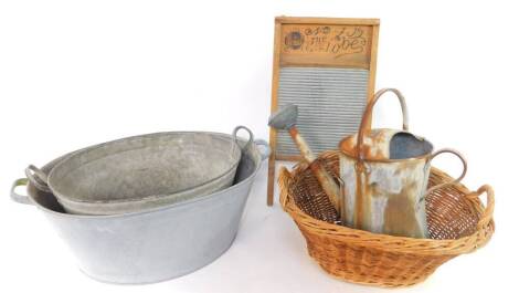 Two galvanized wash tubs, watering can with rose, wicker basket and wash board marked The Globe no. 409. (5)