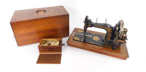 A Pfaff mahogany cased sewing machine.