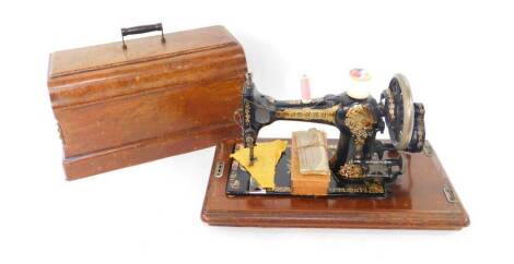 A Jones walnut cased sewing machine.