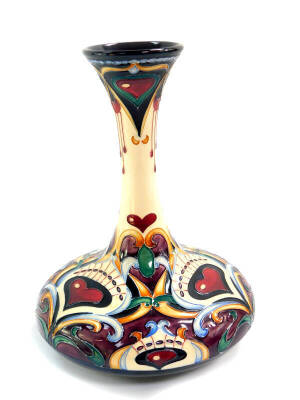 A Moorcroft limited edition pottery vase, painted in the Lassie O' My Heart pattern, designed by Rachel Bishop, of long necked compressed form, 26/150, signed, impressed and painted marks, 24.5cm high.