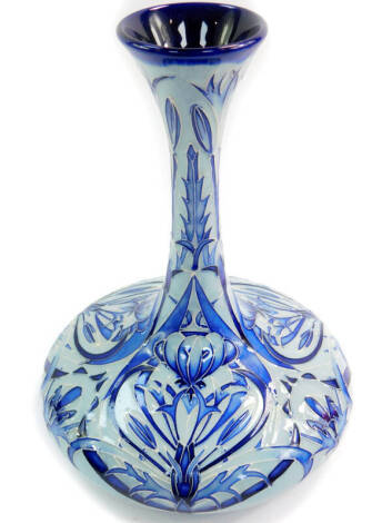 A Moorcroft pottery 2003 vase, tube line decorated in the Florian style with blue on blue flowers, painted and impressed marks, 24cm high.