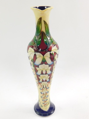 A Moorcroft pottery jug, decorated in the Wisteria pattern by Phillip Gibson, limited edition 54/150, 2005, of elongated balaster form, painted and impressed marks, 32cm high. - 4