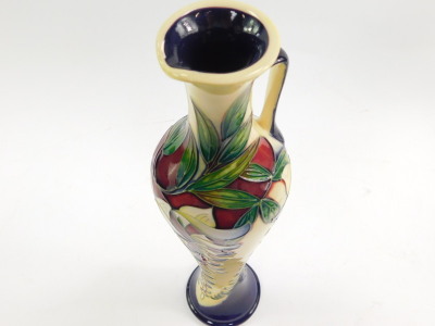 A Moorcroft pottery jug, decorated in the Wisteria pattern by Phillip Gibson, limited edition 54/150, 2005, of elongated balaster form, painted and impressed marks, 32cm high. - 5