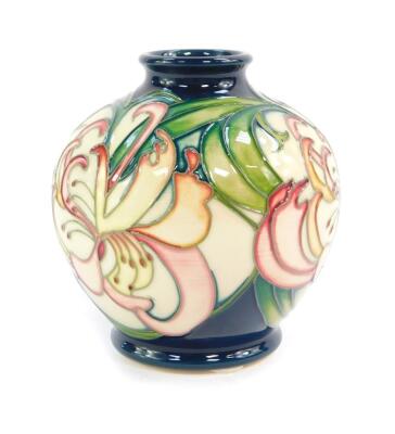 A Moorcroft pottery vase, decorated with Wisteria, of globular form, signed, limited edition 8/30, circa 2009, painted and impressed marks, 11.5cm high.