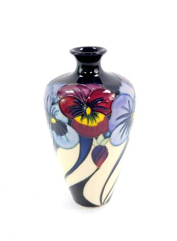 A Moorcroft pottery vase, decorated in a pansies pattern, monogrammed R J B, limited edition 18/50, circa 2010, painted and impressed marks, 16cm high.