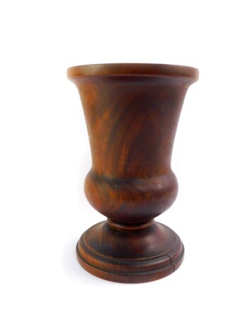 A large walnut treen bell shaped vase, 14cm high.