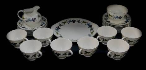 A Royal Doulton porcelain Burgundy pattern tea service, comprising bread plate, cream jug, sugar bowl, eight cups, saucers and plates.