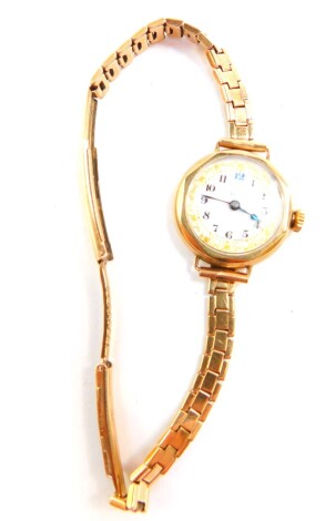 A lady's 9ct gold cased wristwatch, circular white dial bearing Arabic numerals, Swiss movement, on a 9ct gold strap, 20g.