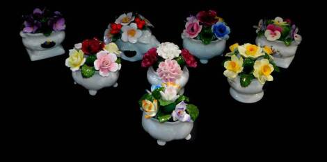 Eight Aynsley porcelain monthly flower ornaments, comprising February Crocus., April Daffodil., June mixed Roses., July Pansy., August Carnation., October Anemone., Novemeber Violet., and December Christmas Rose., together with six boxes.