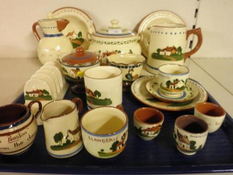 A Torquay Pottery biscuit barrel and cover and a large quantity