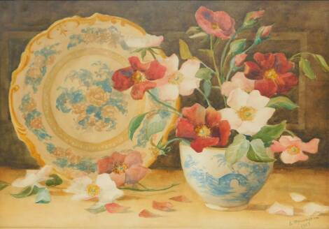E Massingham (British, Early 20thC). Still life of wild roses and ceramics, watercolour, signed, dated 1907, 31.5cm high, 45.5cm wide.