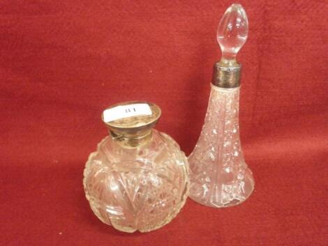 A cut glass and silver mounted scent bottle and a cut glass scent