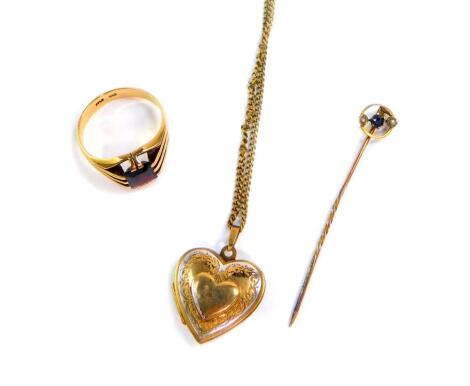 A 9ct gold and garnet gentleman's signet ring, size U, 5.9g., a sapphire and seed pearl set circular stick pin, in yellow metal stamped 9ct, 1.0g., and a gilt metal heart shaped locket on chain. (3)