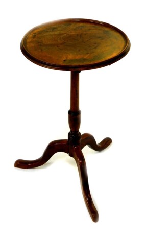 A George III mahogany wine table, the circular top raised on a turned column over three cabriole legs, diameter 40.5cm, height 72cm.