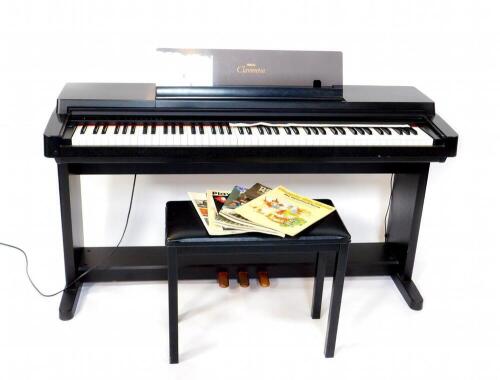 A Yamaha Clavinova, model CLP-560, together with a stool and sheet music.