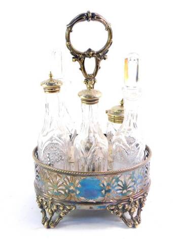 A Victorian silver plated cruet stand containing six bottles, three with plated lids, 29cm high.