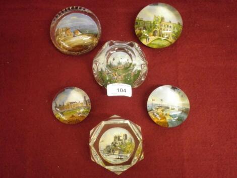 A Victorian moulded glass paperweight inset with a print of Brighton Pavilion