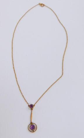A Victorian Art Nouveau amethyst pendant, set in yellow metal, stamped 9ct, on a belcher link neck chain, on a bolt ring clasp, 2.8g.
