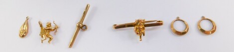 A 9ct gold Lincoln Imp bar brooch, Albert chain T bar, charm formed as Cupid, a pair of hoop earrings, and a pendant, 9.4g. (4)