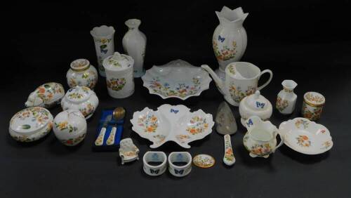 A group of Aynsley porcelain decorated in the Cottage Garden pattern, including vases, preserve pot and cover, pig box and cover, watering can, napkin rings, plates, vases, etc. (a quantity)