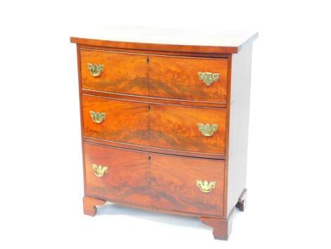 A George III mahogany bow front chest, of three long graduated drawers, raised on bracket feet, 88cm high, 77cm wide, 43cm deep.