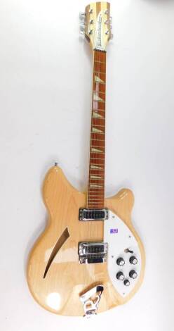 A Rickenbacker 360 maple glo semi hollow electric guitar, maple cased, six string, with five knob layout, serial number 0145590, cased.